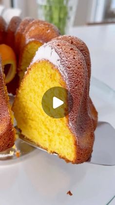 a bundt cake on a plate with a slice cut out