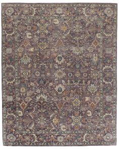 an antique rug with many different colors and patterns