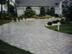 a driveway in front of a large house