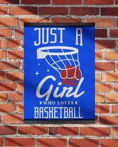 a blue sign that says just a girl who loves basketball hanging on a brick wall