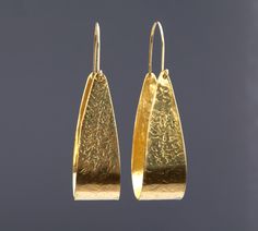 "Sure to attract a lot of attention, this pair of golden toned brass earrings has a tapered textured brass plate bent in deep swing seat shape, hung by a brass hoop wire at the top. Total length: 80 mm brass plate portion: 57 mm brass plate width: \"swing seat\" 37 mm, belt width 20 mm If you have questions, please send me a message." Elegant Textured Brass Jewelry, Party Brass Hoop Earrings With Ear Wire, Formal Hammered Brass Earrings, Elegant Hammered Hoop Earrings For Party, Brass Hoop Earrings With Ear Wire For Formal Occasions, Elegant Hand Forged Brass Hoop Earrings, Formal Brass Hoop Earrings With Ear Wire, Brass Plate, Brass Hoops