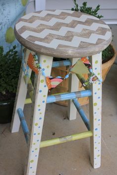 a wooden stool sitting on top of a patio