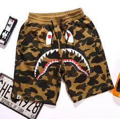 BAPE Camo Shark Shorts Some of our top selling shorts from BAPE that are made… Bape Clothing, Supreme Fashion, Bape Camo, Shark Head, Bape Shark, Purple Camouflage, Camouflage Shorts, Blue Camouflage, White Camo