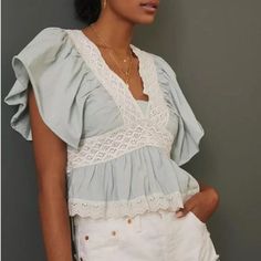 Nwt!! Never Been Worn! Description: V Neck Short Ruffle Sleeves Crochet Lace On Top Eyelet Embroidery On Top Measurements/Item Details Size - Small Bust - 18" Across (Laying Flat) Length - 19.5" Approx Color - Sky Fabric - Cotton Please Note: This Item Is New With Tags. Chic Lace Patchwork Tops For Spring, Chic Lace Patchwork Top, Casual Lace Top With Ruffles, Chic Lace Patchwork Top For Day Out, Casual Lace Tops With Ruffles, Chic Spring Tops With Lace Trim, Cute V-neck Top With Lace Trim, Chic V-neck Lace Top With Ruffles, Feminine Lace Top With Lace Trim For Day Out