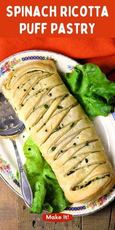 spinach ricotta puff pastry on a plate with lettuce and a spoon