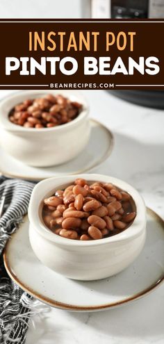 two white bowls filled with pinto beans on top of a table