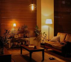 a living room filled with furniture and lamps