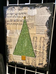 a christmas tree made out of old sheet music