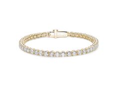 Beautifully handcrafted in 14k gold, our tennis bracelets feature a continuous row of round brilliant cut lab-grown diamonds, graded at VS+ clarity, Very Good cut and G/H color. Each bracelet features a secure diamond set push clasp which fits seamlessly with the design. Our stones are made to a consistently high standard and are inscribed with a mark of quality invisible to the naked eye. Visit our quality page for full details on our stone grading. Classic 14k Gold Diamond Bracelet With Vvs Clarity, Luxury Yellow Gold Round Cut Bracelet, Classic Yellow Gold Diamond Bracelet With Prong Setting, Classic 14k Gold Diamond Bracelet, Formal 14k Gold Bracelets With Vvs Clarity, Adjustable White Gold Classic Bracelet, Classic Yellow Gold Tennis Bracelet For Formal Events, Classic Adjustable White Gold Bracelet, Classic 14k Gold Bracelet With Prong Setting