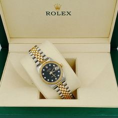 Women's Midsize Rolex 18K Gold Two Tone 31mm DateJust Watch with Black Diamond Dial and Fluted Bezel. Pre-Owned Brand: Rolex. Bezel: Fluted. Dial: Diamond. Dial Color: Black. Crystal: Sapphire. Condition: Good. Gender: Women's. Dial: Diamond Dial. Case Dimensions: 31mm Midsize. Movement: Self-Winding (Automatic). Metal Type: 18K Yellow Gold / Stainless Steel. Bracelet / Strap: Jubilee 18K Gold / Stainless Steel. Box / Certificate: Rolex Box / Certificate of Authenticity. Service Warranty: One (1 Datejust 36mm Woman, Elegant Black Diamond Watch As A Gift, Elegant Black Diamond Watch Gift, Elegant Black Diamond Watch As Gift, Elegant Black Jewelry And Watches For Anniversary, Luxury Black Diamond Watch With Polished Finish, Two Toned Watch, Rolex Womens, Rolex Datejust Women