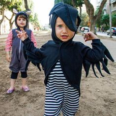 two young children dressed up in costumes