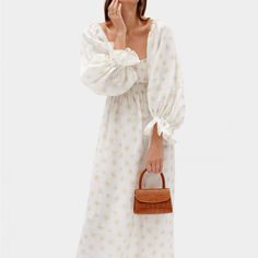 Our Iconic Atlanta Dress Has Gotten A New Look With This Latest Print That Channels The Romantic Vibe Of Walks In Fields Of Blooms. Featuring Billowing Sleeves, A Shirred Bodice And Ruffled Cuffs, This Dainty White Daisy Dress Is Made Of Natural Linen That Will Ensure You Keep Cool Even On Those Sweltering Summer Days. Sleeper Dress, White Daisy Dress, Opera Dress, Pink Gingham Dress, Blue Slip Dress, White Silk Dress, Dancer Dress, Sheer Midi Dress, Luxury Loungewear