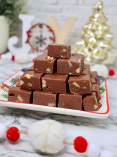 a white plate topped with chocolate fudges on top of a table