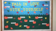 fall in love with yourself bulletin board on the wall above it is an apple theme