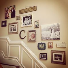 a staircase with many pictures on the wall