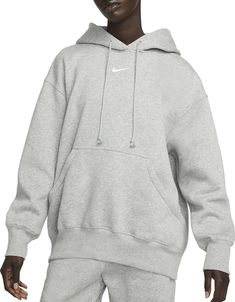 Grounded in style, comfort and versatility, meet Nike's take on luxury loungewear. This classic hoodie helps you stay cozy all day long, thanks to midweight fleece that feels soft yet structured. Plus, exaggerated details (like taller ribbing and oversized fit) give you a trend-right look. Fit & Design: Oversized fit: exaggerated and spacious Fits large; we recommend ordering a size down Midweight brushed fleece feels extra soft on the inside and smooth on the outside, helping you stay cozy while keeping its structured shape Dropped shoulders and roomy sleeves provide a relaxed, oversized feel Drawcord hood Elongated ribbing Oversized pocket Embroidered Swoosh logo Nike Sportswear Phoenix Fleece, Sporty Hoodie, Grey Nike Hoodie, Nike Sportswear Women, Polo Sport Ralph Lauren, Loungewear Luxury, Zip Hoodies, Nike Shox, Oversized Pullover