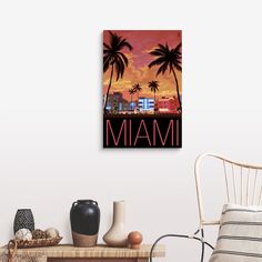 the miami skyline at sunset with palm trees and buildings in the background, framed on a white wall