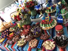 an assortment of desserts and candies on a table