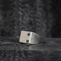 Introducing the Oval Signet Ring - a reworked design that exudes elegance and sophistication. This ring features the iconic message ____ engraved around the crown, serving as a reminder of the wearer's triumphs and accomplishments. Crafted in the classic signet ring style, this piece is a timeless addition to any jewelry collection. The oval shape adds a modern touch, while the intricate details showcase the expert craftsmanship. With its meaningful message and beautiful design, this ring is perfect for those who want to make a statement and leave a lasting impression. "All conditioned things are Impermanent."-Sterling silver 925.-Size: 20mm by 15mm. Thickness 1-2mm.-Engraved around the crown. Specifications -Signet Ring style, reworked design. -Sterling silver 925. -Size: 20mm by 15mm. Th Modern Engraved Jewelry For Promise, Minimalist Signet Ring With Engraving For Promise, Minimalist Promise Signet Ring With Engraving Option, Symbolic Oval Etched Signet Ring, Symbolic Etched Oval Signet Ring, Luxury Silver Jewelry With Engraved Logo, Classic Promise Engraved Ring, Timeless Silver Engraved Ring, Luxury Silver Rings With Etched Details