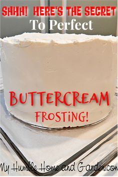 there is a white frosted cake with red writing on it and the words buttercream frosting