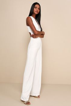 Your admirers will have a lot to say about their love for you in the Lulus Thinking Out Loud White Backless Jumpsuit! Medium-weight crepe knit forms a sleeveless darted bodice with a V-neck and wide straps that cross over the open back. Bit of elastic at the waist tops the wide-leg pants. Fit: This garment fits true to size. Length: Floor length. Size medium measures 62" from shoulder to hem. Inseam: 32.25 Front Rise: 13.00 Bust: Great for any cup size. Waist: Fitted - stretchy fabric allows cus Fitted Jumpsuits With Back Opening, Chic White Backless Jumpsuit, Fitted Jumpsuits And Rompers With Back Opening, Fitted Strapless Sleeveless Jumpsuit For Date Night, White Backless Jumpsuits And Rompers For Date Night, White Fitted Strapless Sleeveless Jumpsuit, Fitted Summer Jumpsuit With Back Opening, Fitted Summer Jumpsuits And Rompers With Back Opening, Chic Fitted Halter Neck Jumpsuits And Rompers