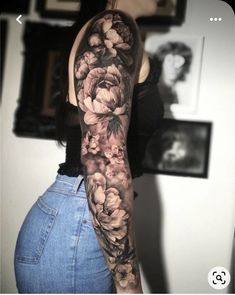 a woman's arm with flowers on it