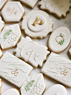 decorated cookies are arranged on a table