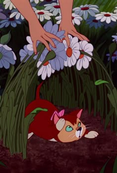 an animated image of a cat laying on the ground in front of some daisies