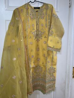 Bin saeed orignal organza kameez shalwar 3 pc in medium size 21 chest length 40" Yellow Long Sleeve Salwar Kameez With Sheer Dupatta, Party Sharara In Organza With Naqshi Detailing, Party Sharara With Naqshi In Organza, Organza Sharara With Naqshi For Party, Festive Naqshi Embroidered Organza Kurta, Yellow Kurta With Sheer Dupatta For Party, Bollywood Style Naqshi Embroidered Organza Traditional Wear, Bollywood Style Traditional Wear In Organza With Naqshi, Bollywood Style Organza Traditional Wear With Naqshi