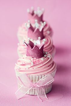 cupcakes with pink frosting and a crown on top