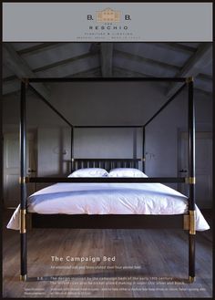 a four poster bed with white sheets and pillows in a room that has wood floors