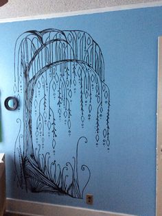 a blue wall with an artistic drawing on it