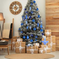 a decorated christmas tree with presents under it