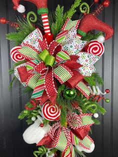 a christmas wreath with candy canes and decorations