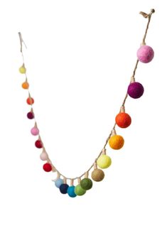 multicolored felt ball garland on a white background