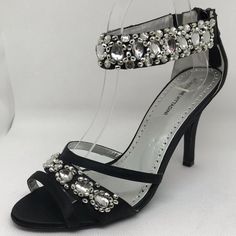 Adrienne Vittadini Gabrielle Black Rhinestone Dressy Strappy Sandal Stiletto Condition: New, Unworn Without Box Style: Gabrielle Color: Black Size: 9 Material: Satin Toe: Open Heel Height: 3.8in Original Price: $125 Stock Bin: 2 Stock Code: Blkh3.8inav9 Bedazzled Ankle Strap Heels For Evening, Black Bedazzled Heels For Formal Occasions, Fitted Embellished Heels For Evening, Formal Embellished Fitted Sandals, Glamorous Fitted Sandals With Rhinestones, Elegant Bedazzled Sandals For Evening, Black Fitted Sandals For Wedding, Fitted Rhinestone Sandals For Evening, Elegant Bedazzled Sandals For Formal Occasions