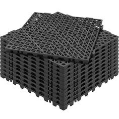 several black plastic pallets stacked on top of each other with holes in the middle