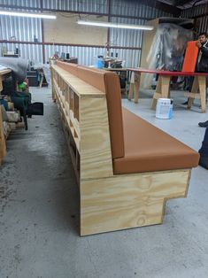 a bench made out of plywood in a warehouse