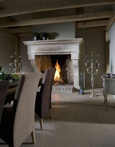 a dining room with a fire place in the fireplace