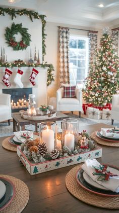 a living room filled with furniture and christmas decorations on top of a wooden table next to a fire place