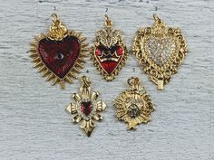 Love these new charms 18k gold plating over brass red epoxy heart on some of them evil eye and royal crown  cz crystals jump ring at top listing is for 1 charm lead, nickel and cadmium free measure from 26-32x14-26mm if you need the exact size of a particular charm please convo me Heart-shaped Gold Plated Charms For Gifts, Gold Heart Charm For Valentine's Day, Gold Heart Charms For Valentine's Day, Valentine's Day Gold Heart Charm, Red Charms For Valentine's Day, Red Charms For Valentine's Day Gift, Red Valentine's Day Gift Charms, Red Heart-shaped Charm Jewelry, Mexican Jewelry