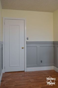 an empty room with white walls and wood flooring is pictured in this image from the doorway