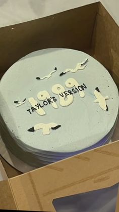 a cake in a box with the words taylor's vision written on it