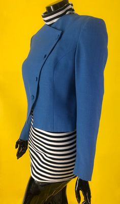 80s crop diagonal button down blazer. The striped turtle neck is not included. Perfect blazer with a trendy cut. Solid blue hue with a mildly textured fabric resembling linen. Fits like a size Medium. Linen Fits, Cropped Blazer, 80s Vintage, 1980s Vintage, Textured Fabric, Blue Hues, Turtle Neck, Size Medium, Blazer