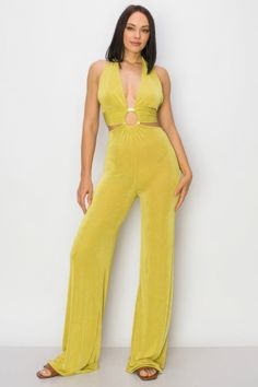 Elevate your style with our Solid Slinky Wide Legs Jumpsuit in vibrant lime green. This chic piece combines a sleek, wide-leg silhouette with a modern o-ring detail, making it a standout choice for any occasion.Key Features:- Fabric: Made from 96% polyester and 4% spandex, offering a smooth and stretchy fit that drapes beautifully.- Fit: True to size with a relaxed, wide-leg design for a flattering and comfortable silhouette.- Color Options: Available in eye-catching lime green.- Sizes: Offered Purple Jumpsuit, Layered Cami, Layered Fits, Verde Lima, Jumpsuit Chic, Jumpsuit Elegant, Activewear Sets, Leg Design, Wide Legs