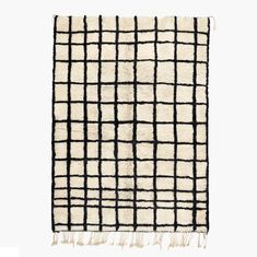 a rug with black and white squares on it