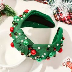 This fabric headband is bejeweled with accent rhinestones in Christmas colors with a top knot accent. Perfect for any holiday party! Holiday Jumpsuit, Green Headband, Christmas Headband, Fabric Headbands, Hair Accessories Gift, White Headband, Christmas Accessories, Pearl Headband, Shoes With Jeans