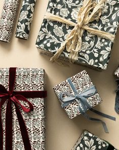 several wrapped presents are laid out on the table