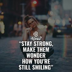 a woman sitting on the ground with her head in her hands and text that reads stay strong, make them wonder how you're still smiling