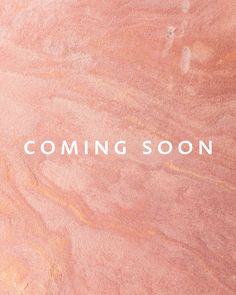 pink marble with the words coming soon in white lettering on it and an orange background